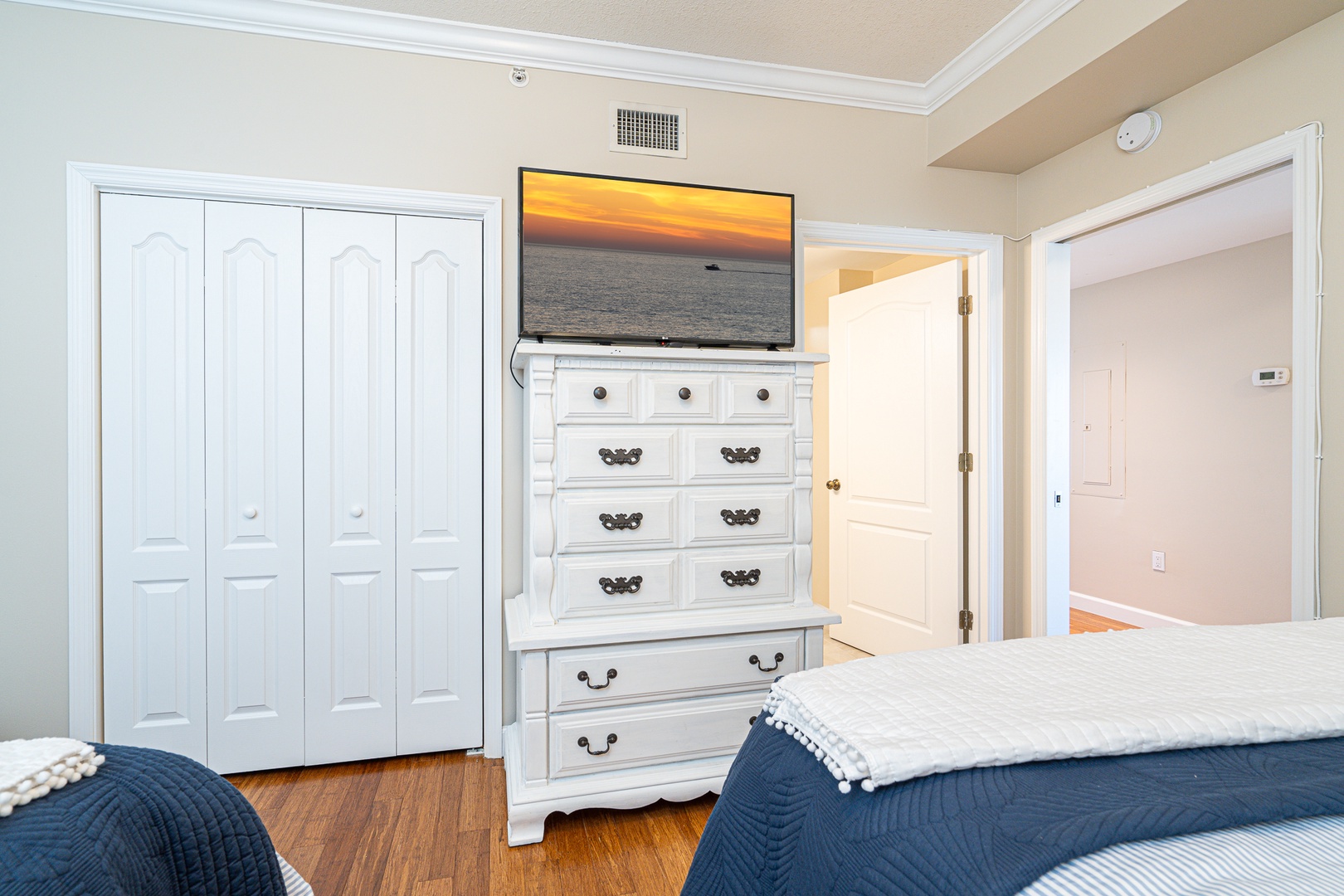 A pair of plush queen beds, Smart TV, & private ensuite await in the final suite