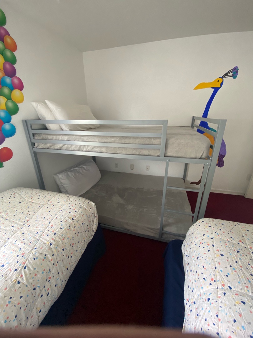 Up themed kids room with 2 Twin beds, full over full bunk bed and TV (2nd floor)