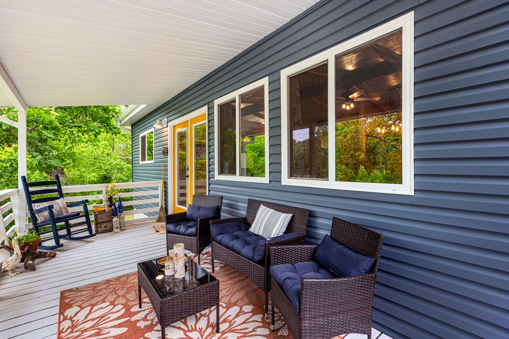 Relax on the porch with a grill, rocking chair, and stunning lake view