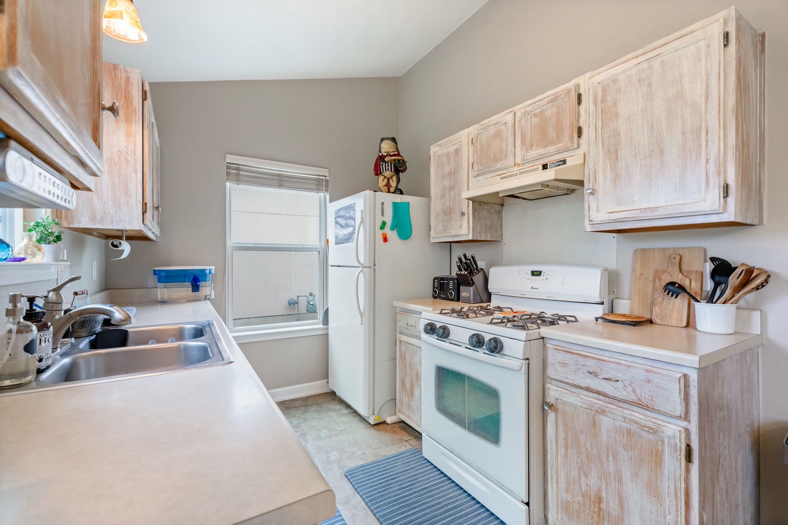 The tranquil kitchen offers ample space & all the comforts of home