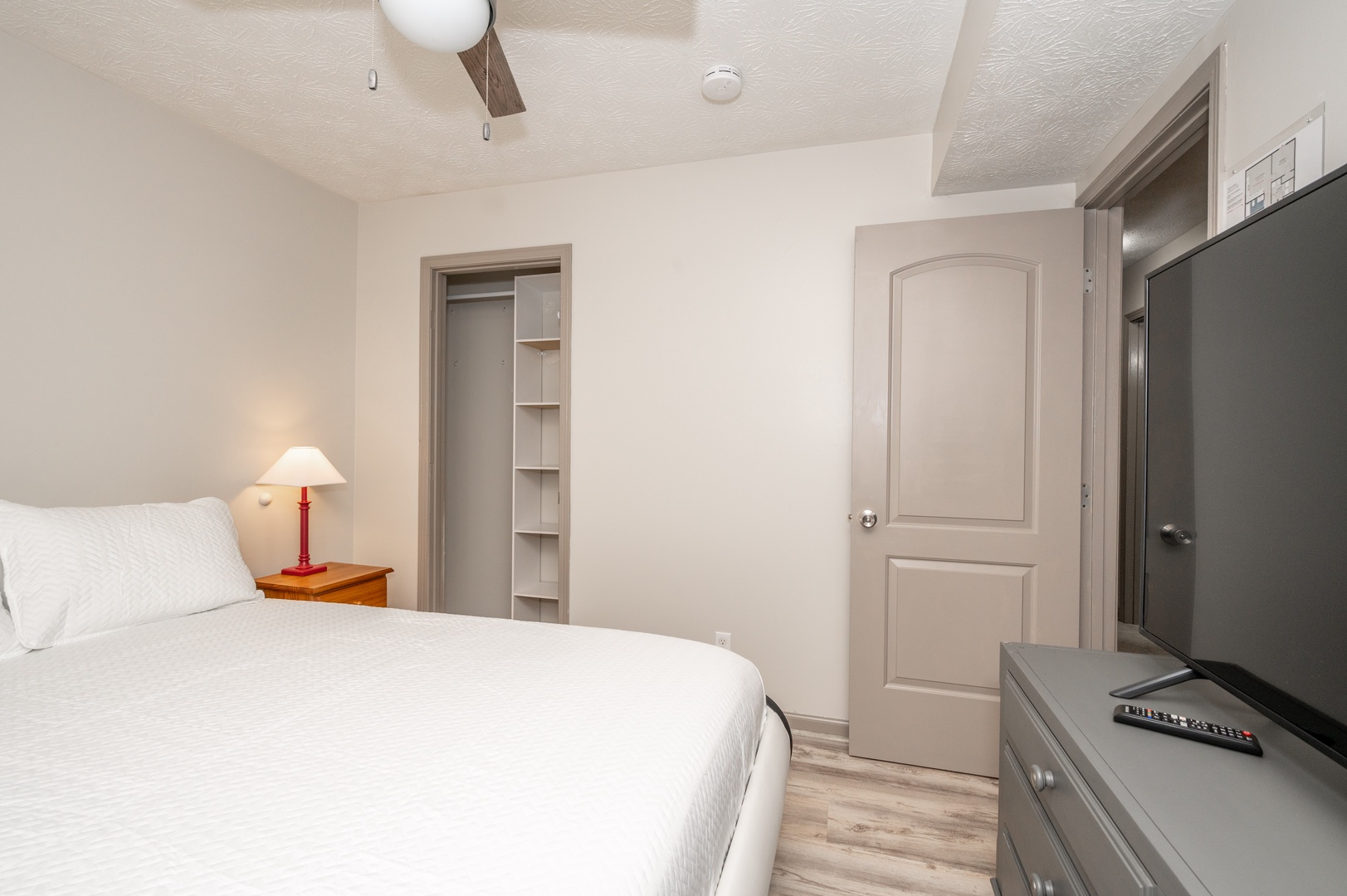 The second bedroom retreat offers a queen-sized bed & Smart TV