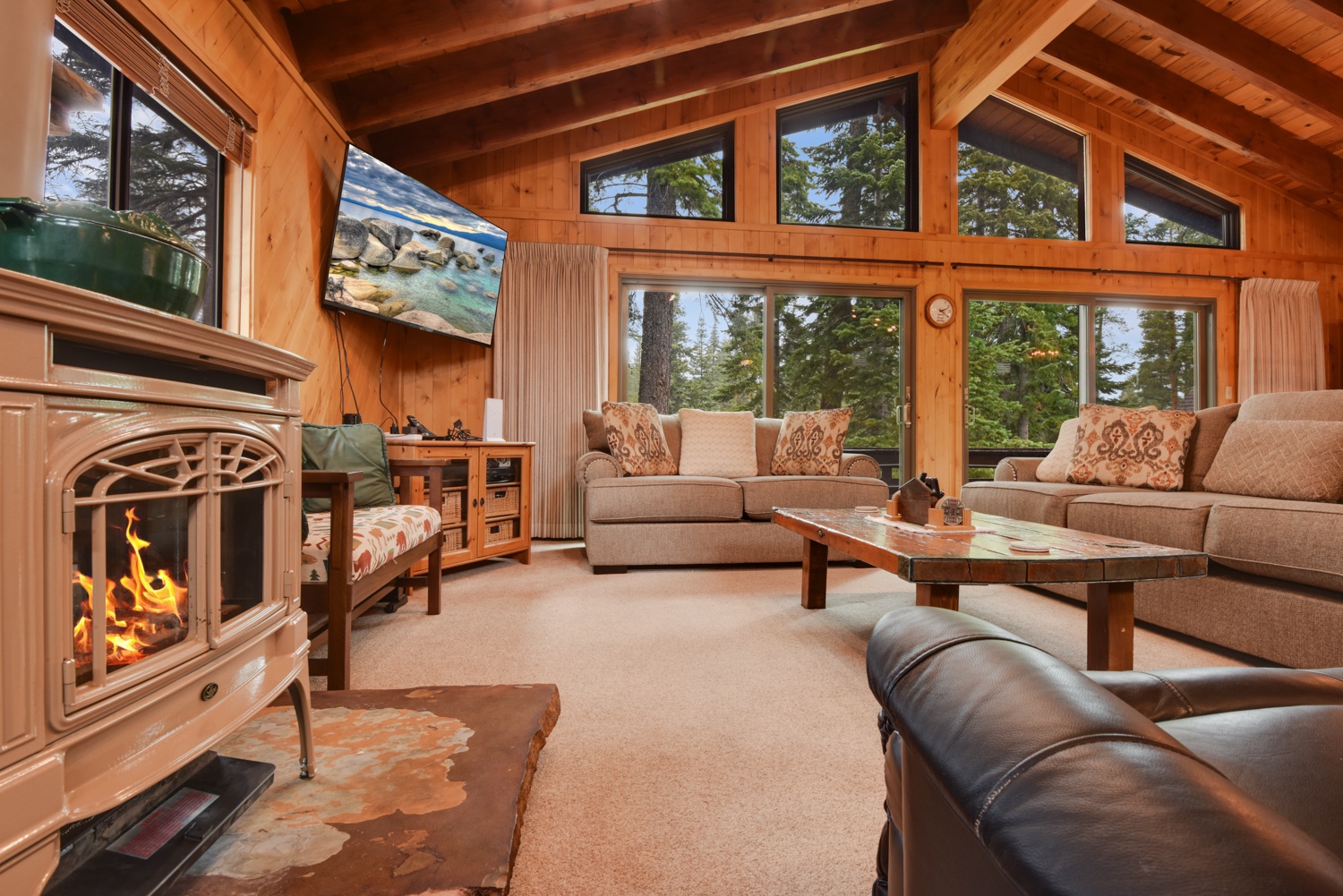 Spacious living space with ample seating, Smart TV, and gas fireplace