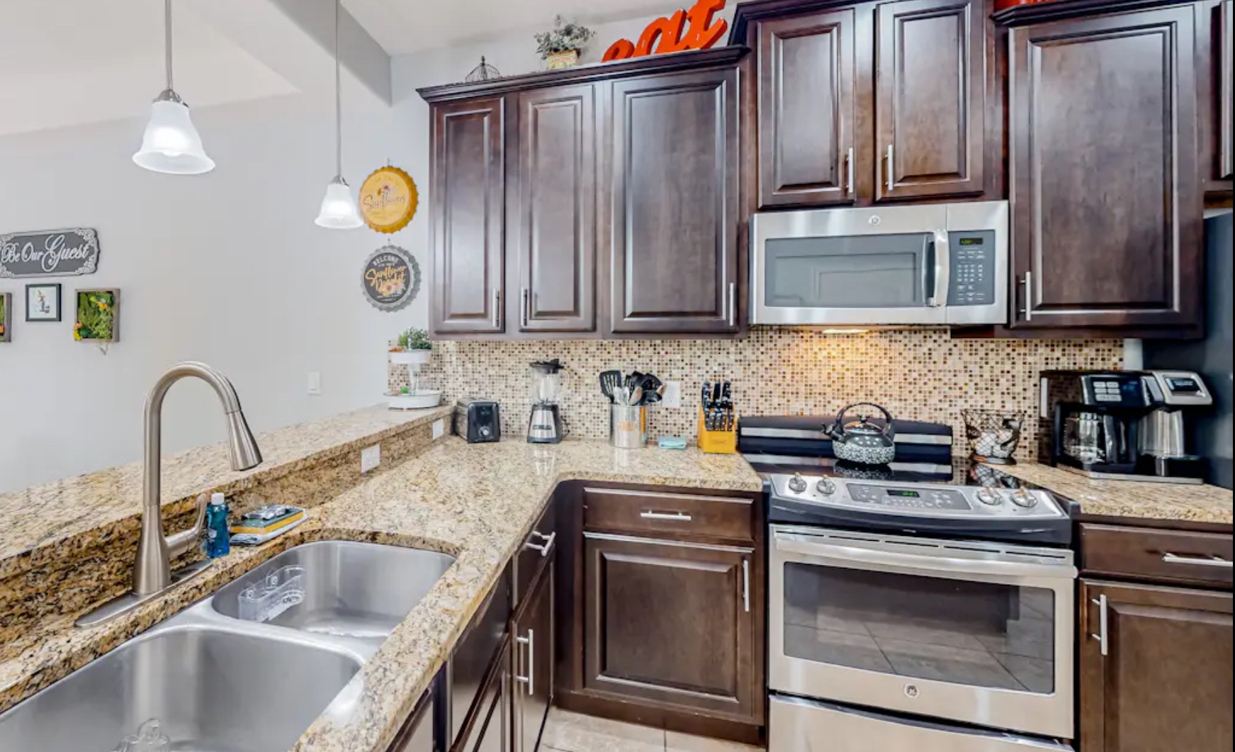 The open, airy kitchen offers ample space & all the comforts of home