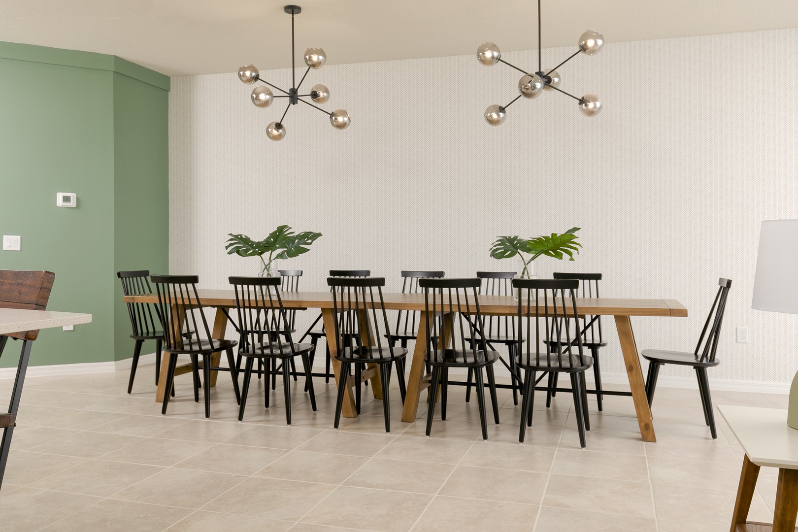 Gather for meals together at the chic dining table, offering seating for 12