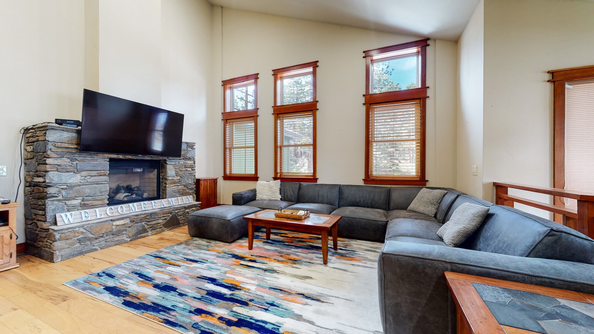 Living room with flat screen TV, gas fireplace and comfortable seating