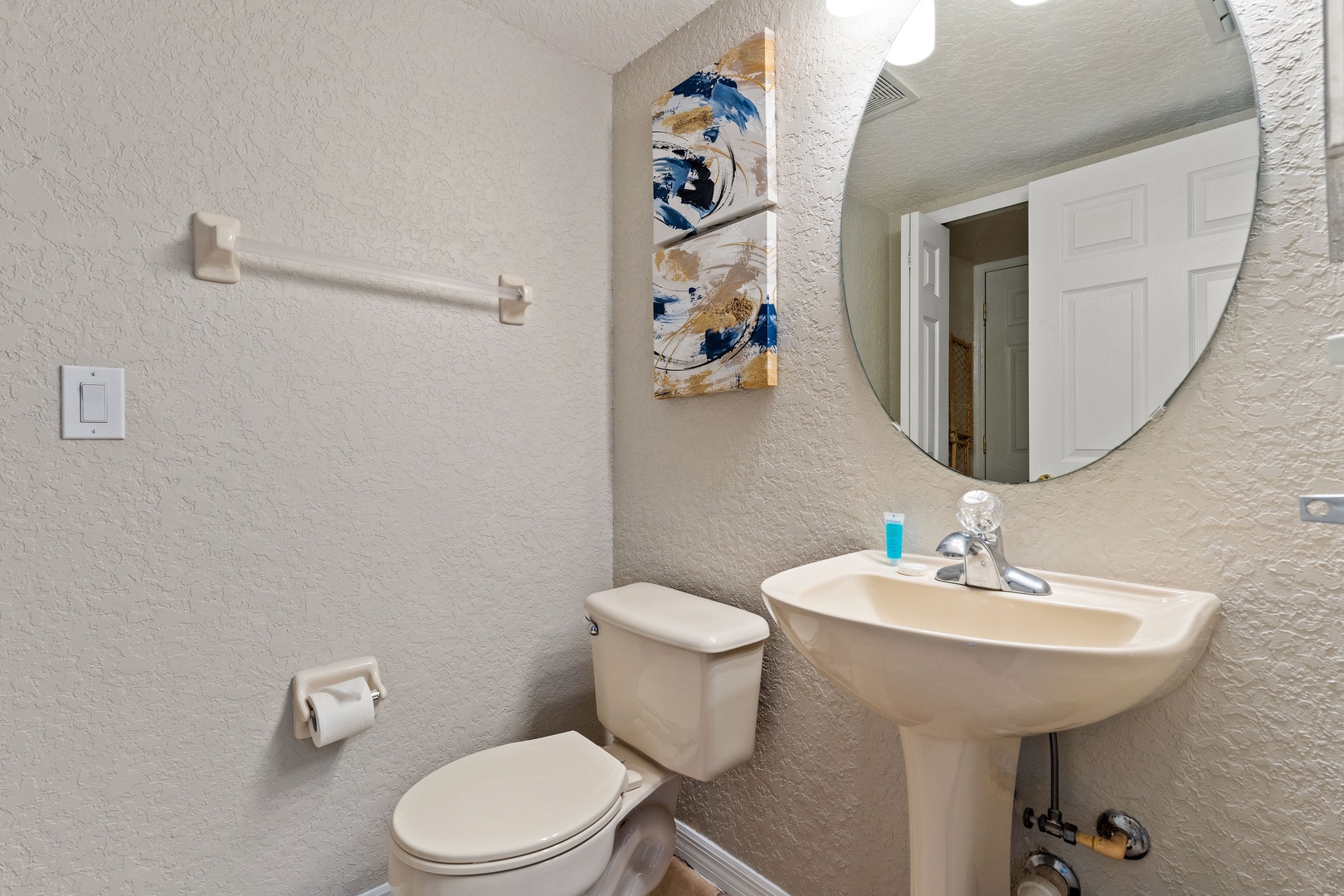 A half bathroom is conveniently tucked away on the main level, just off the entryway