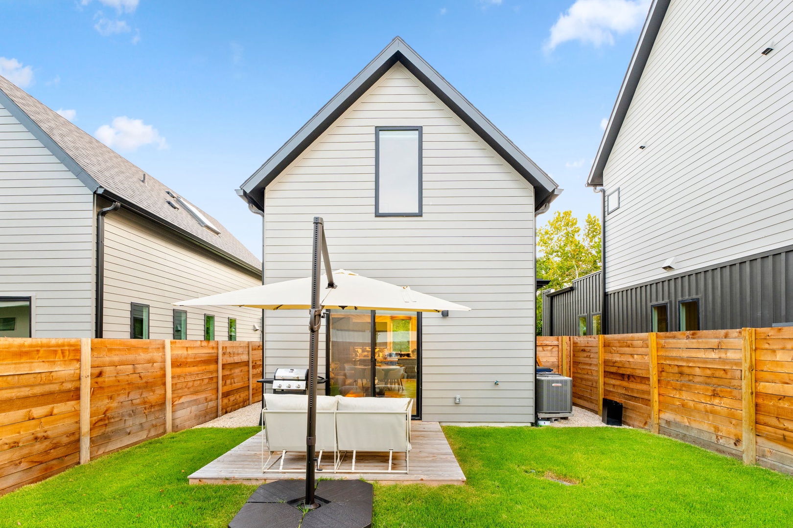 Lounge & take in the sunshine in the spacious, fenced back yard