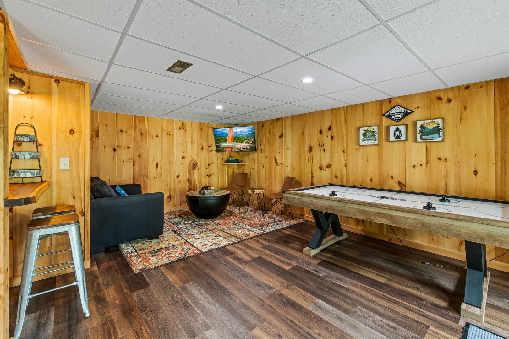 The lower-level game room offers gaming & relaxation options galore!