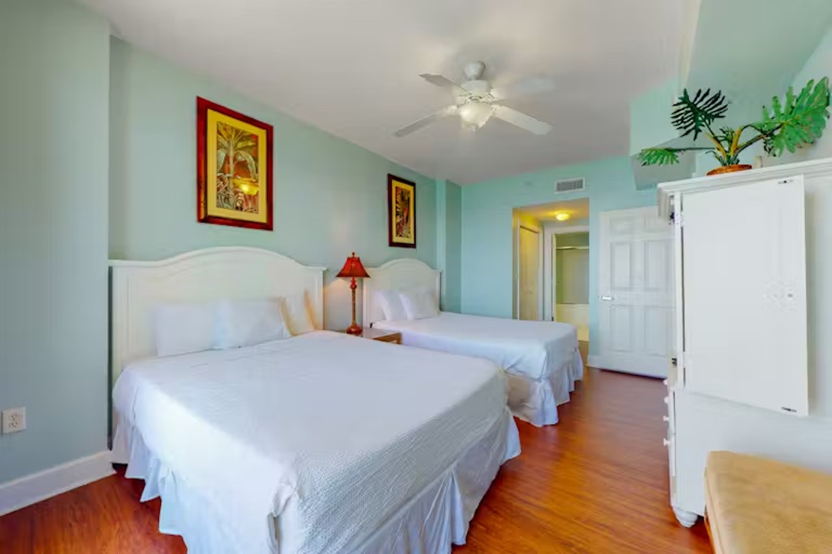 This spacious suite boasts a pair of queen beds, ensuite, & balcony access