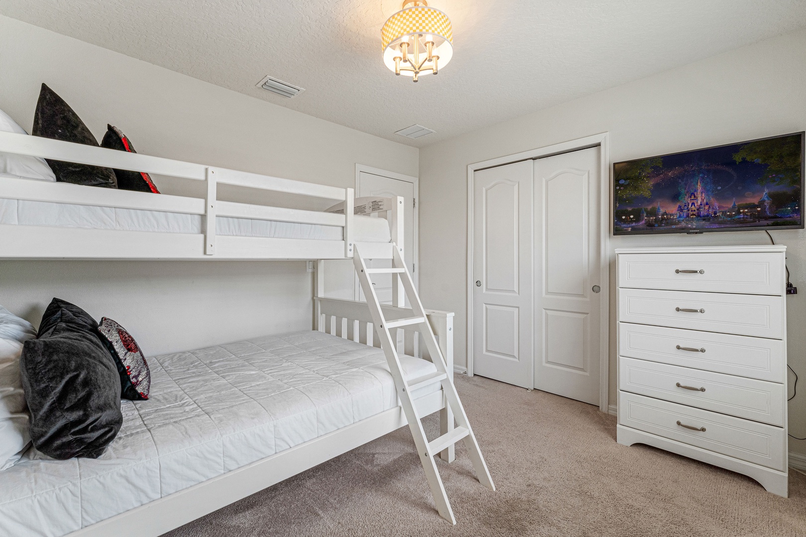 Take a snooze in this twin over full bunkbed room, with smart TV