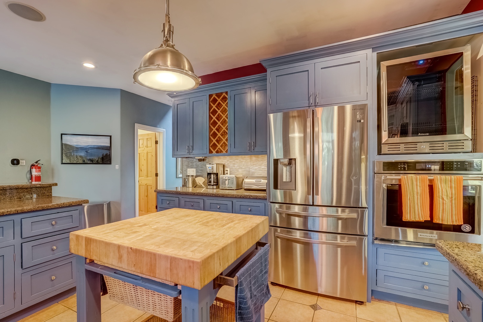 Full kitchen with cutting board island