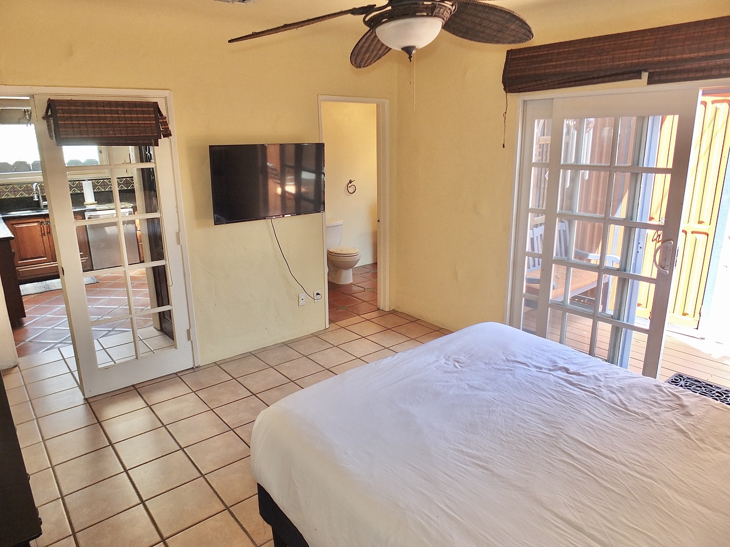 The 1st Floor queen bedroom offers deck access and a private en suite