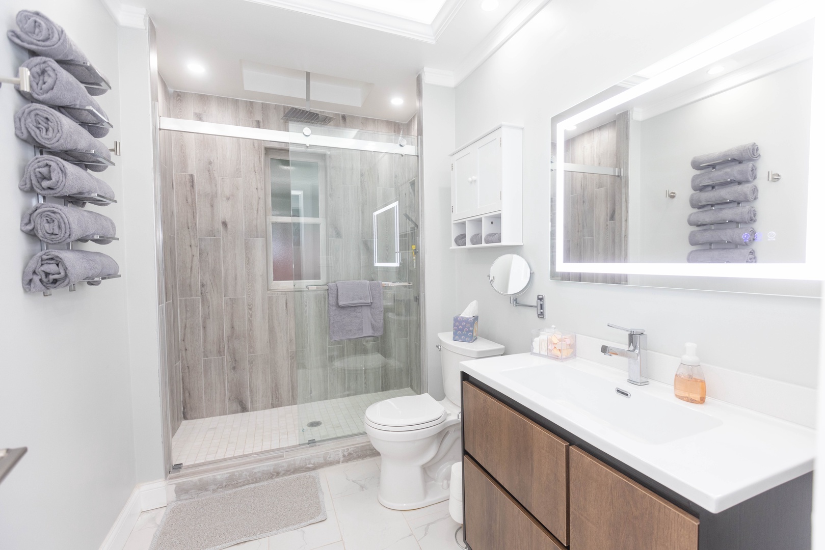 This 2nd floor full bath includes a single vanity & glass shower with rain showerhead