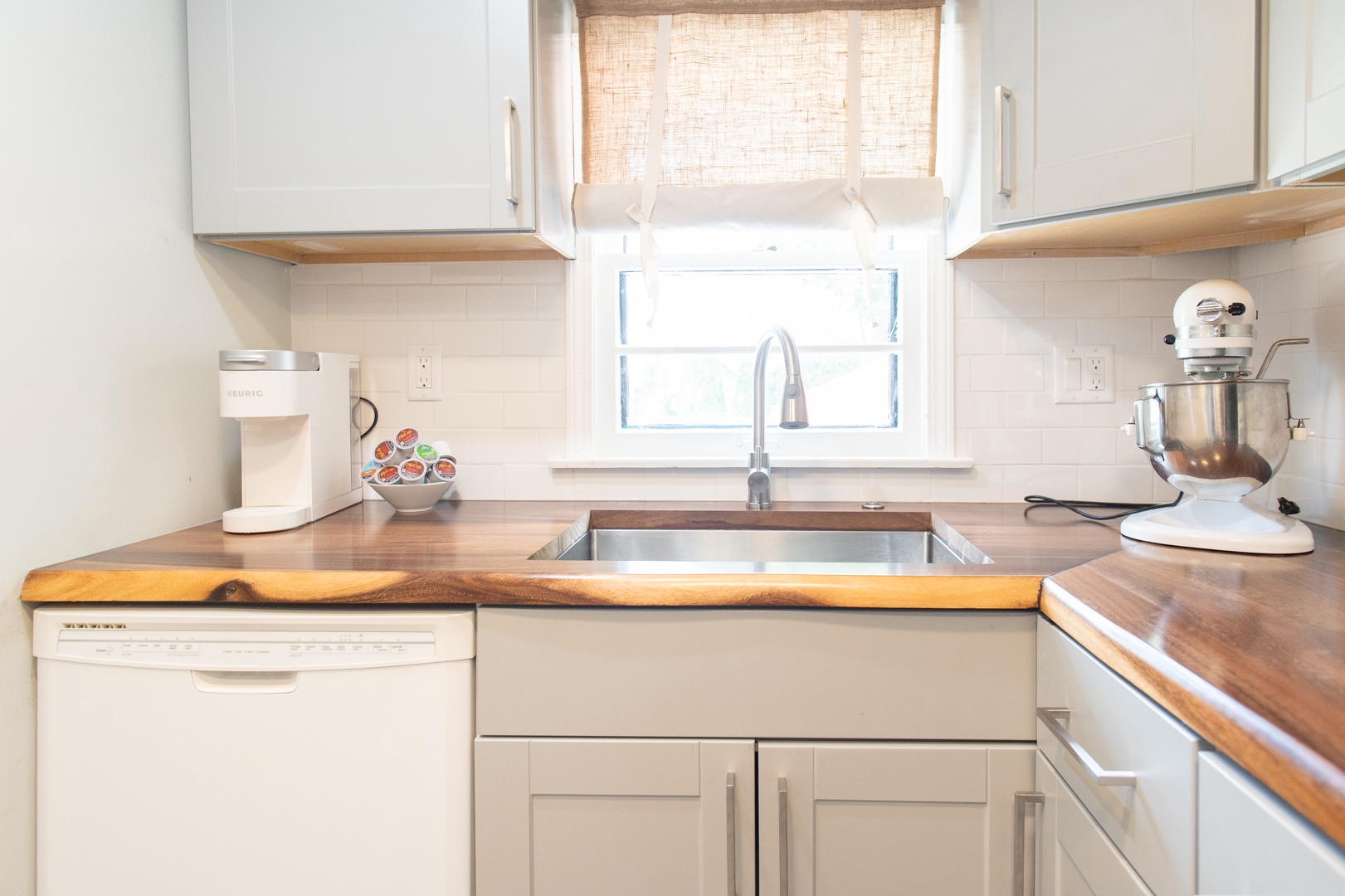 The apartment’s cozy kitchen offers ample space & all the comforts of home