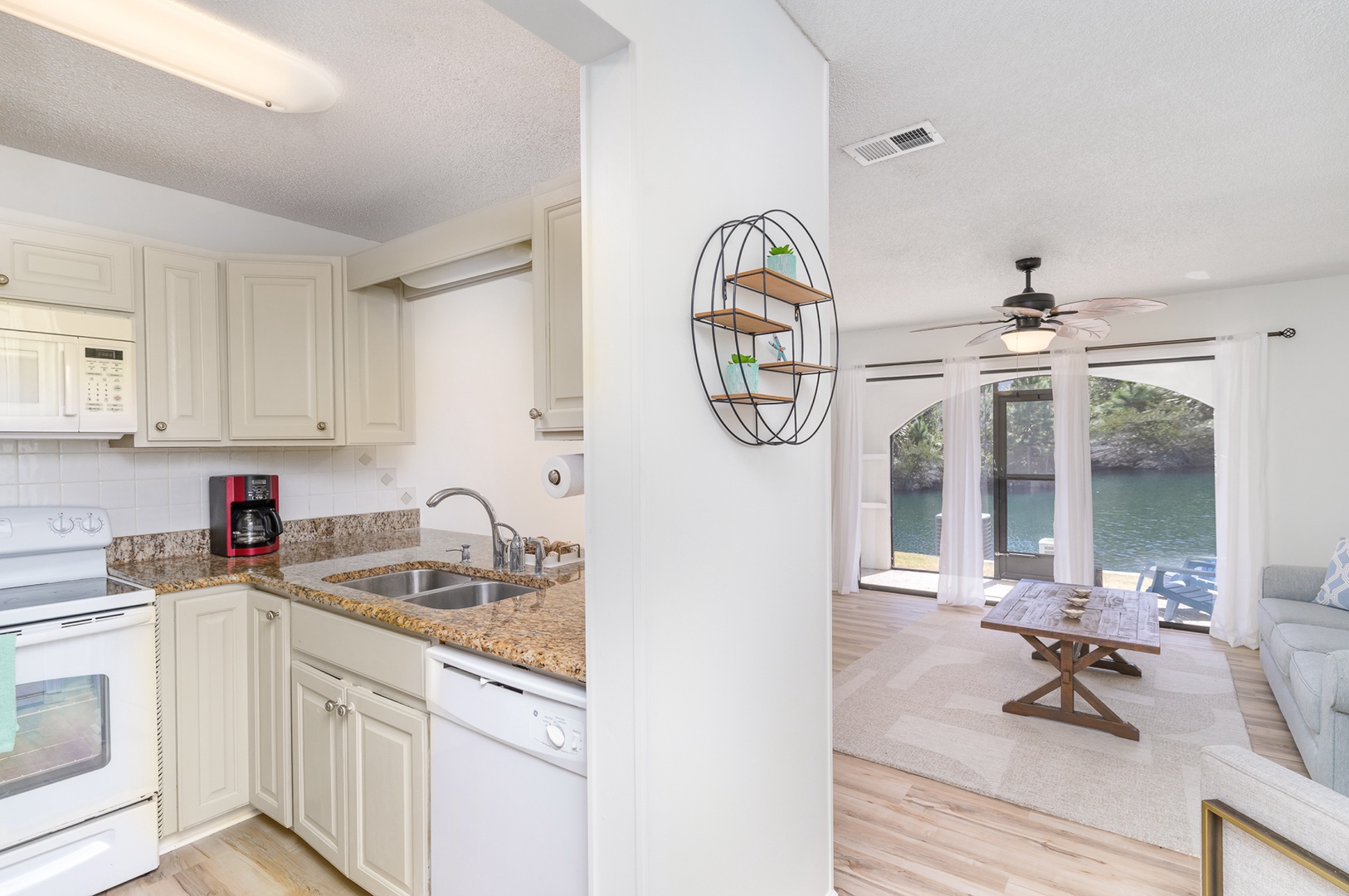 The open, airy kitchen offers ample storage & all the comforts of home