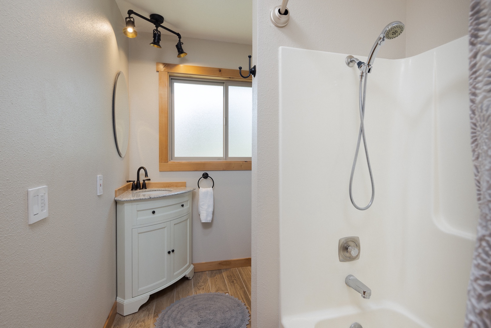 Shared bathroom featuring a shower/tub combination