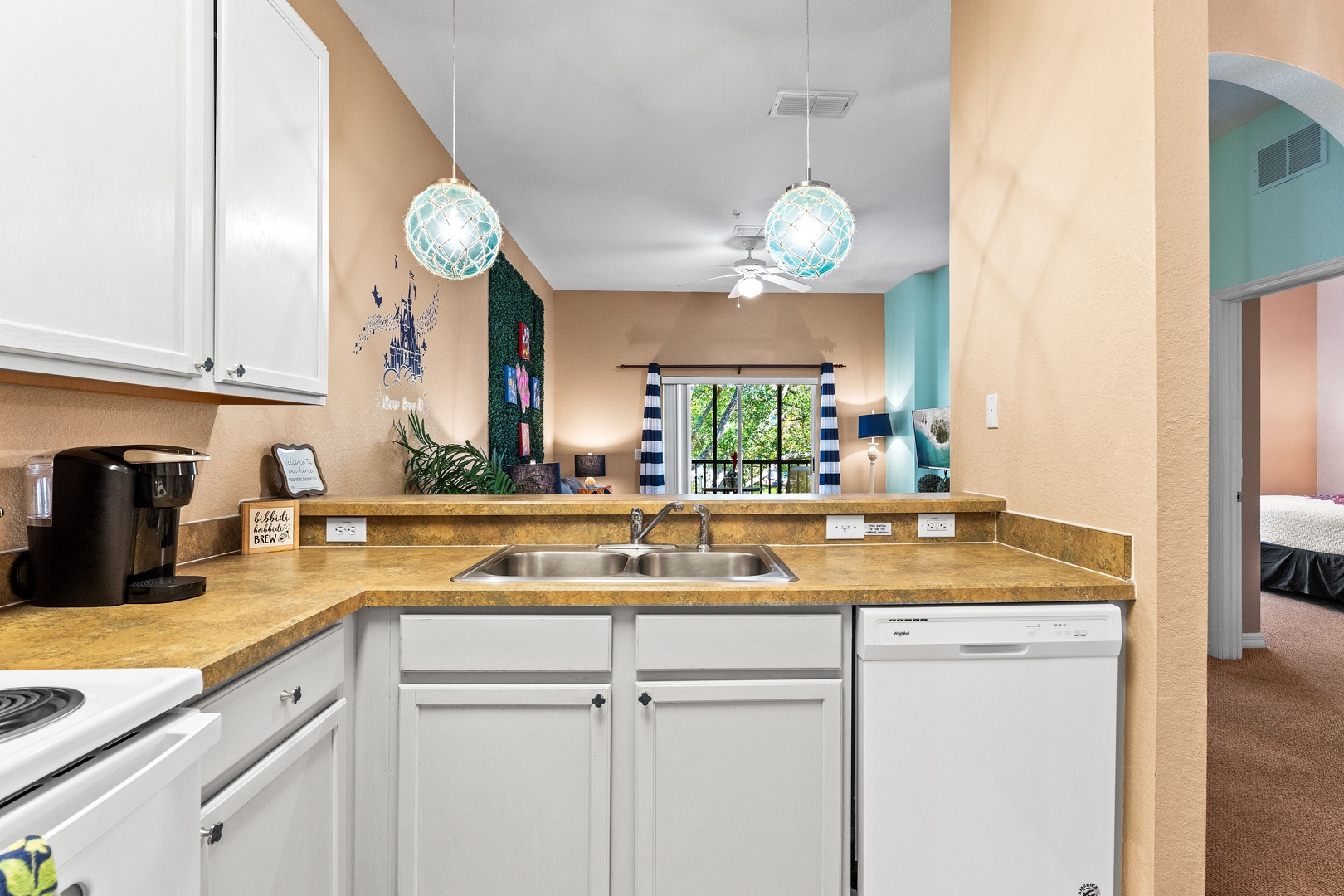 The open, airy kitchen offers ample space & all the comforts of home