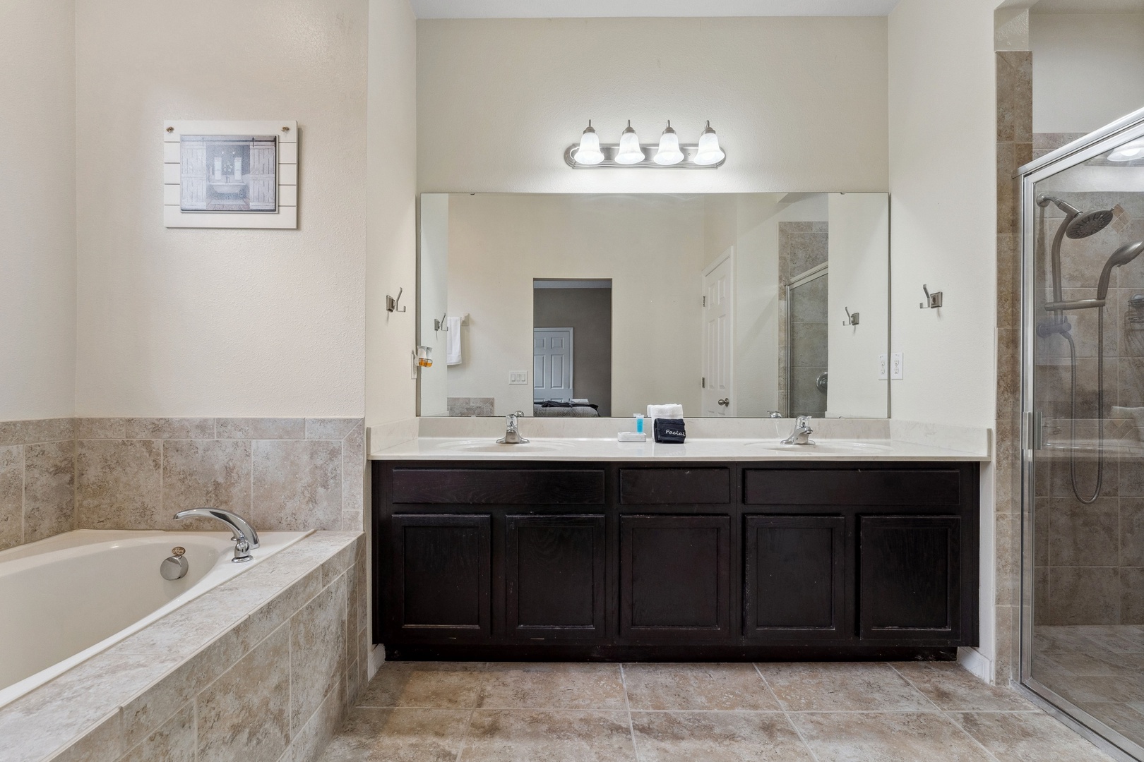 Ensuite bathroom with separate shower and soaking tub