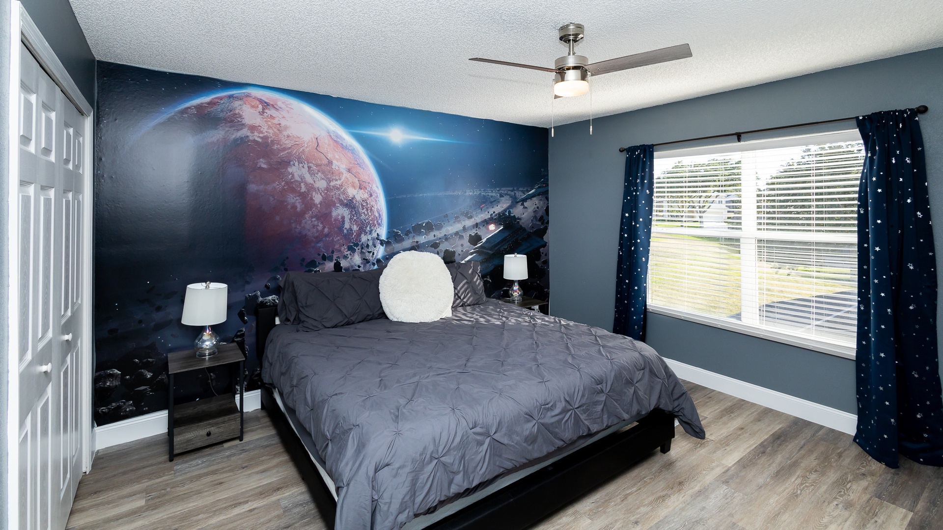 This queen bedroom with a Smart TV will take you to a galaxy far, far away