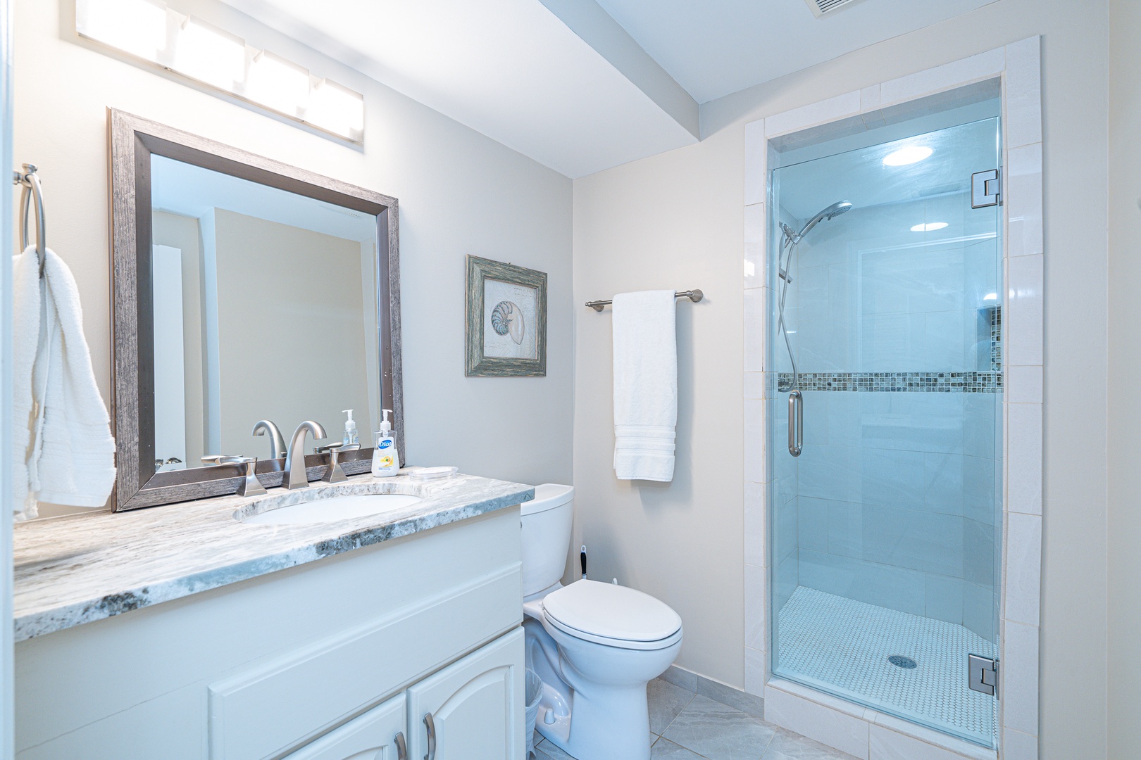 The queen ensuite includes a single vanity & glass shower