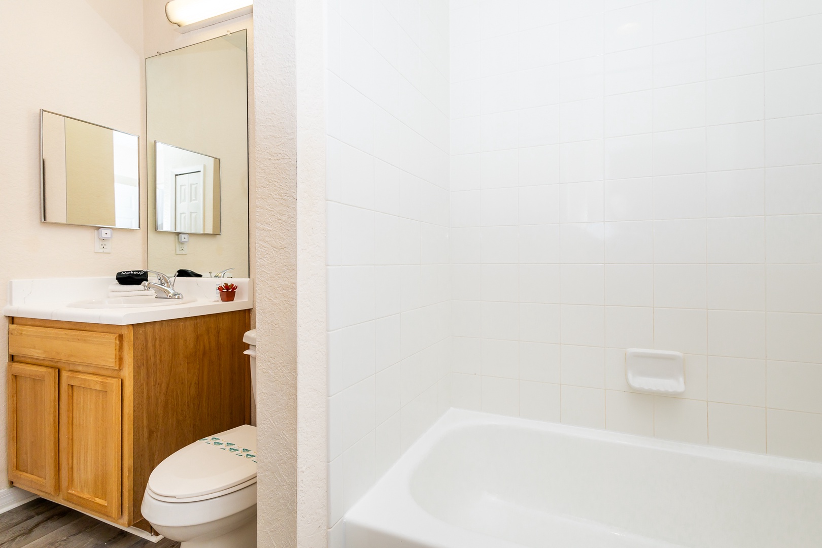 The shared ensuite contains a single vanity & shower/tub combo