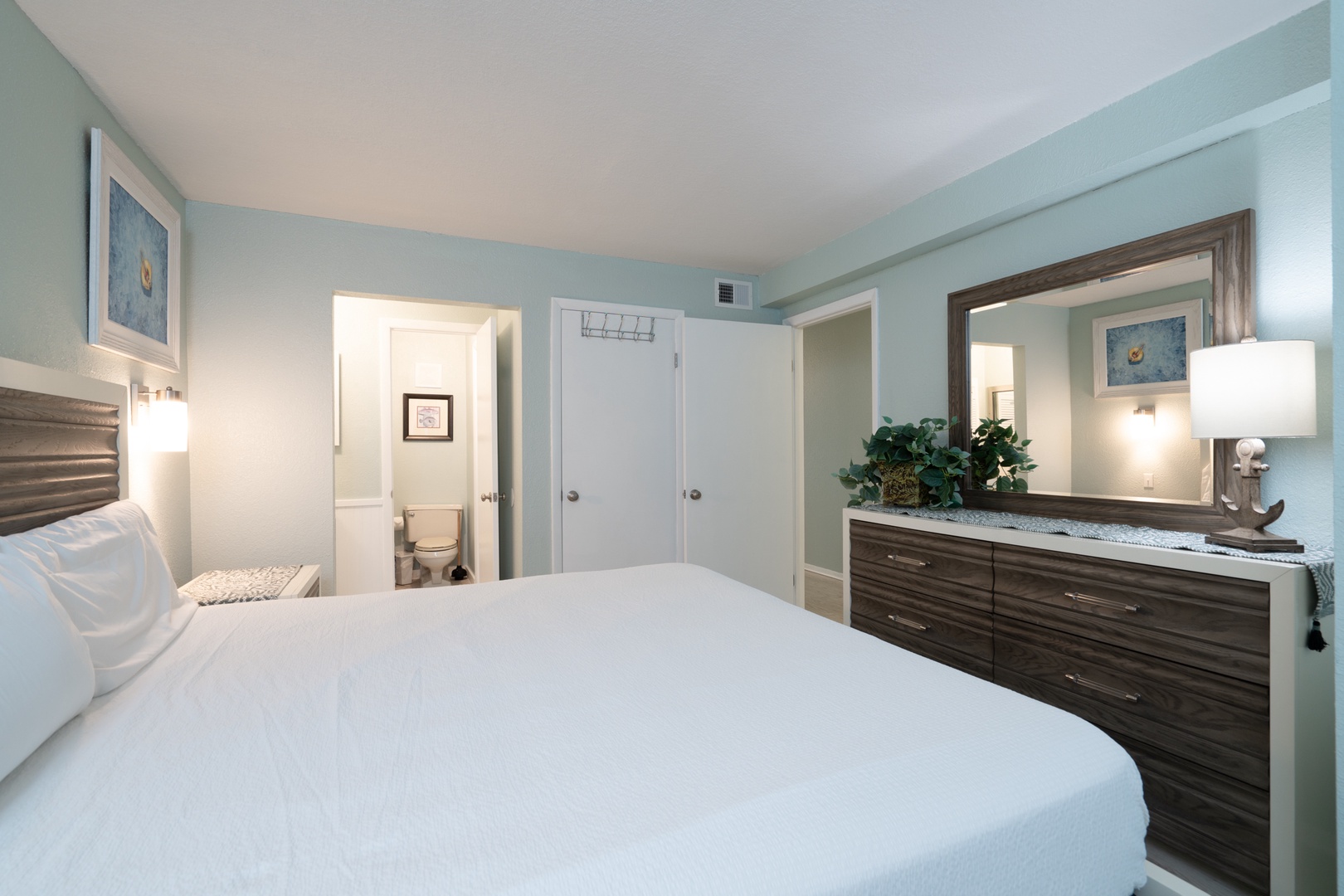 A plush king bed, ensuite bath, & smart TV await in the bedroom retreat