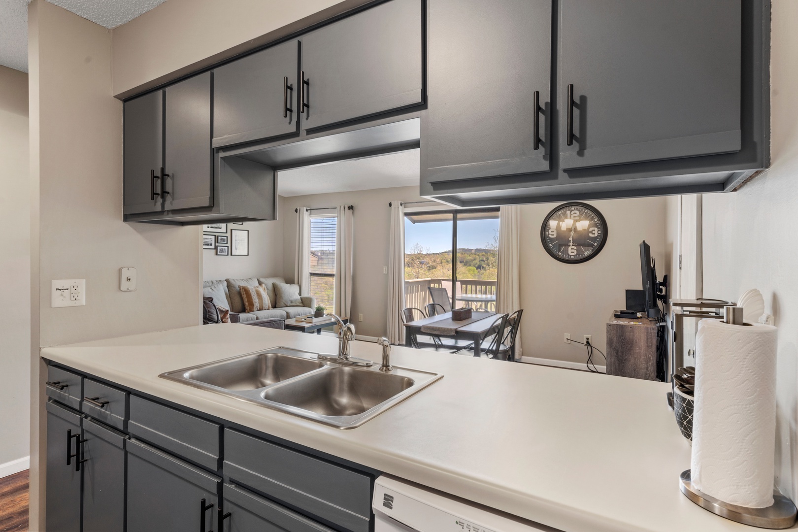 The airy kitchen offers ample space & all the comforts of home