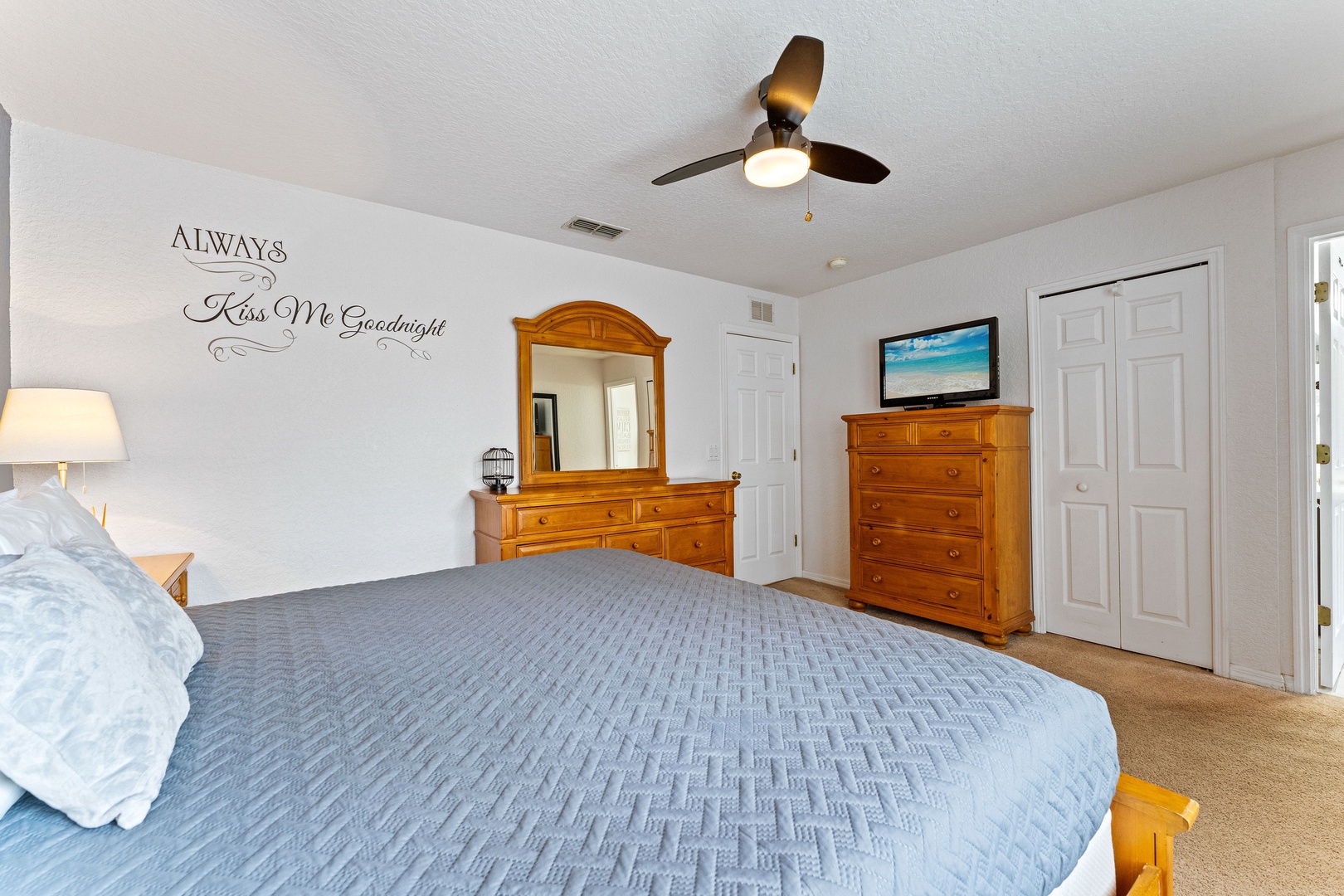 Bedroom 2 with king bed, TV, and ensuite