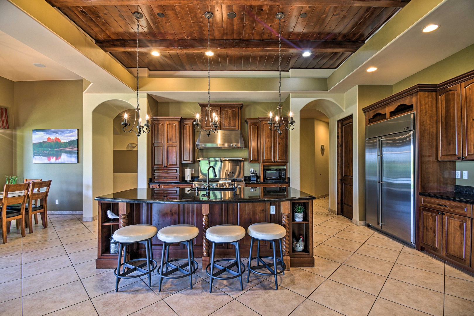 The gorgeous, updated kitchen offers ample space & all the comforts of home