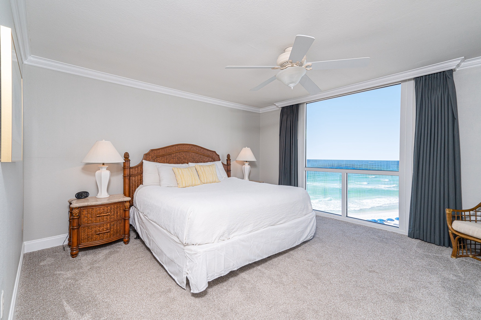 Bedroom 1 with King bed, ocean view, balcony access, TV, and en-suite