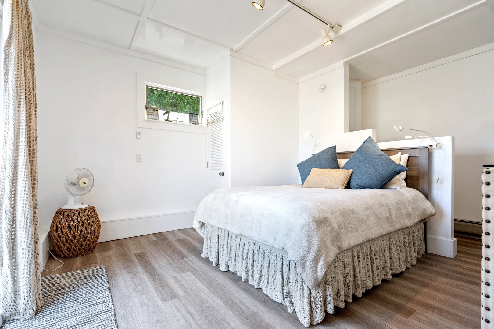 Inviting queen bedroom featuring private patio access