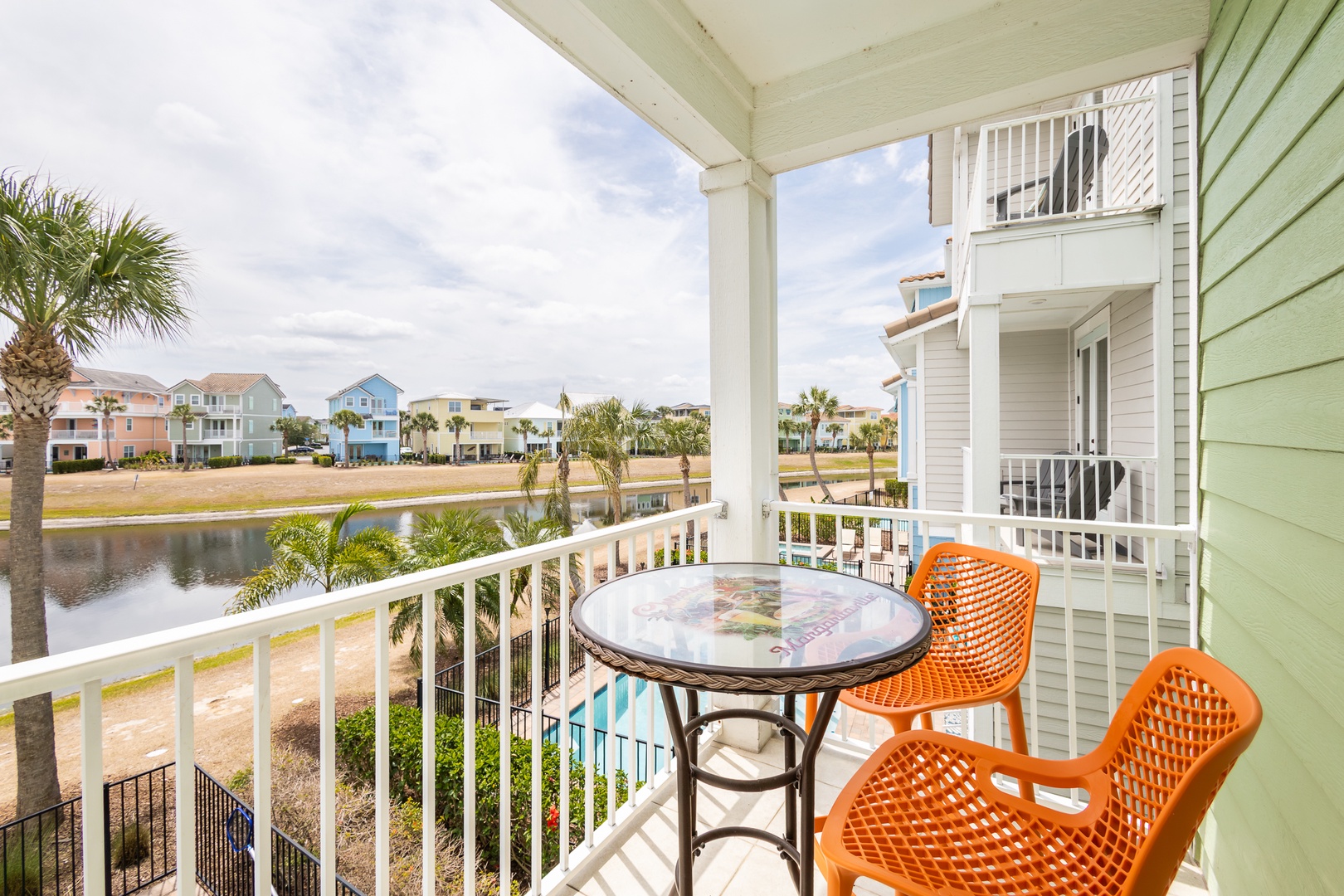 Balcony views from king suite on 2nd floor featuring high top table sitting 2