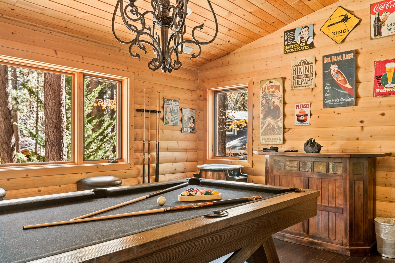 Game room with pool table, arcade game, and electric dart board