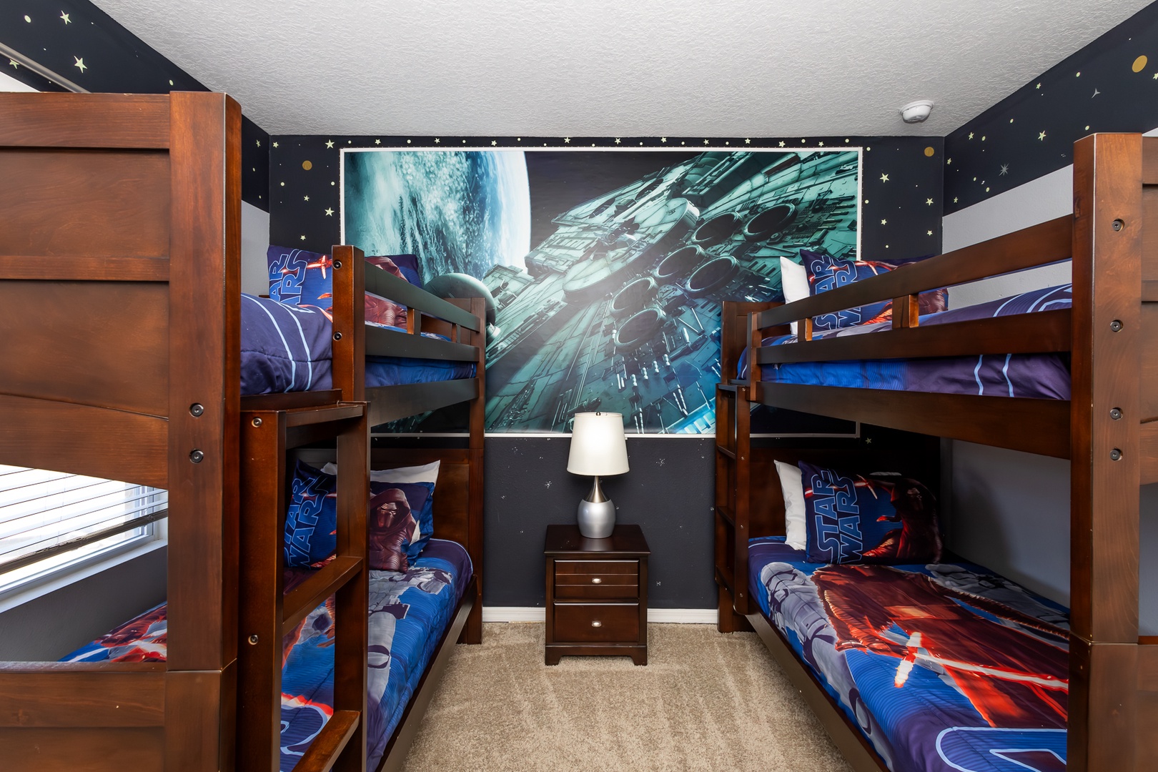 Star Wars-themed bedroom with double twin bunk beds and a smart TV