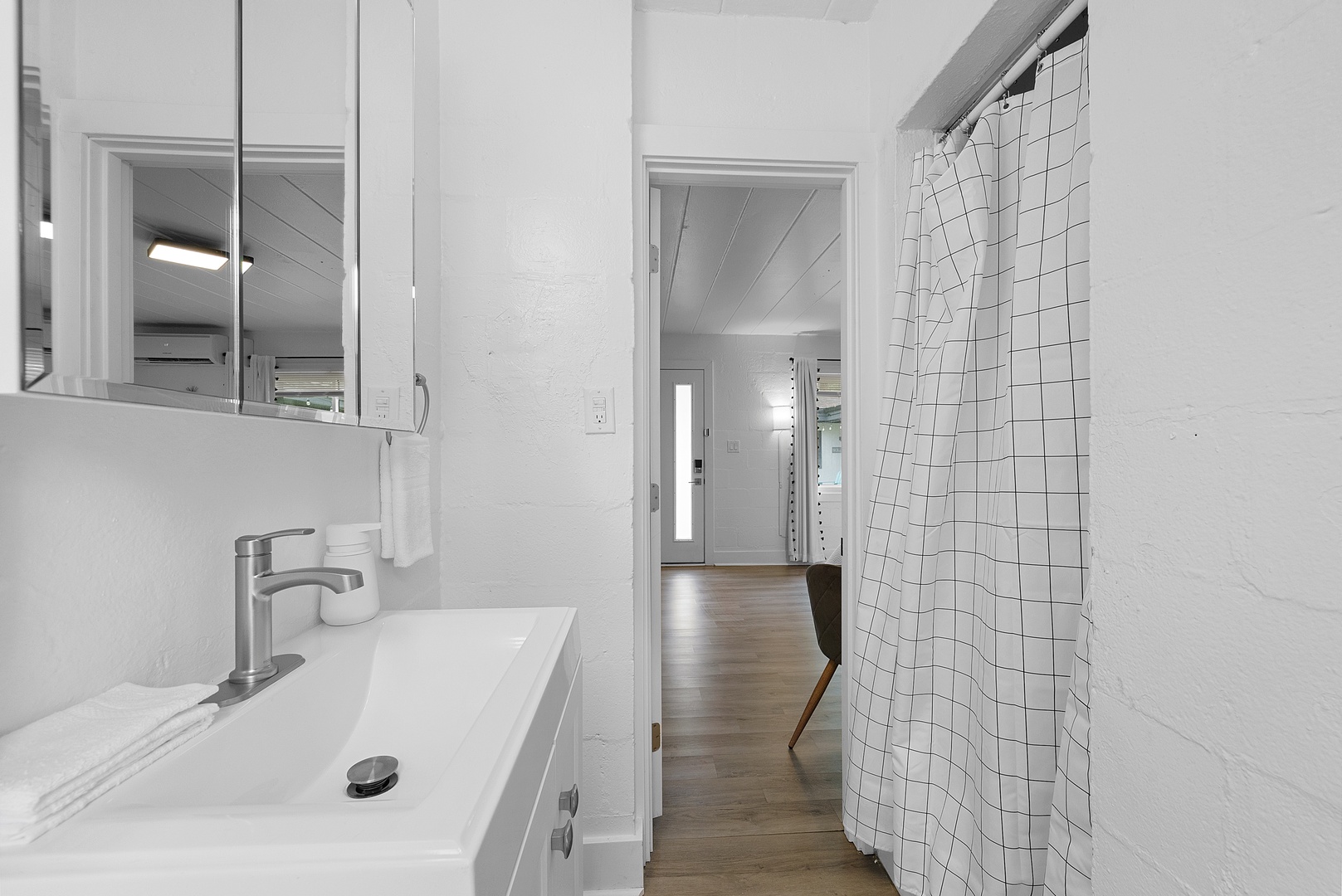 Get ready for the day in the full bath, offering a single vanity & shower