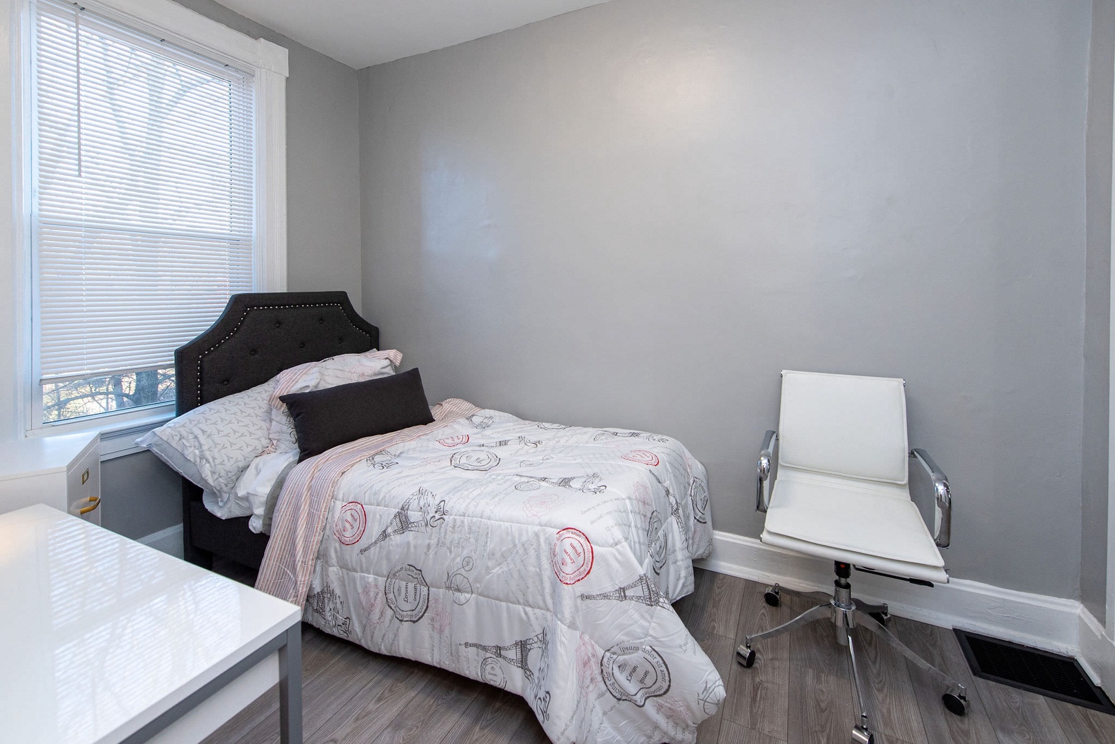Suite 2 – The final bedroom includes a twin bed, chair, & desk/workspace
