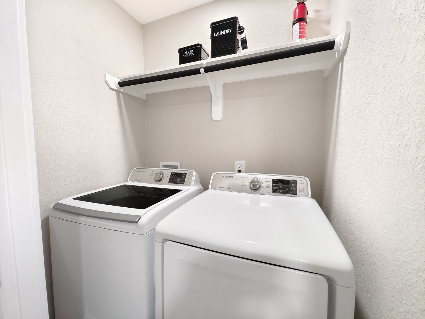 Private laundry is available for your stay, tucked away by the kitchen