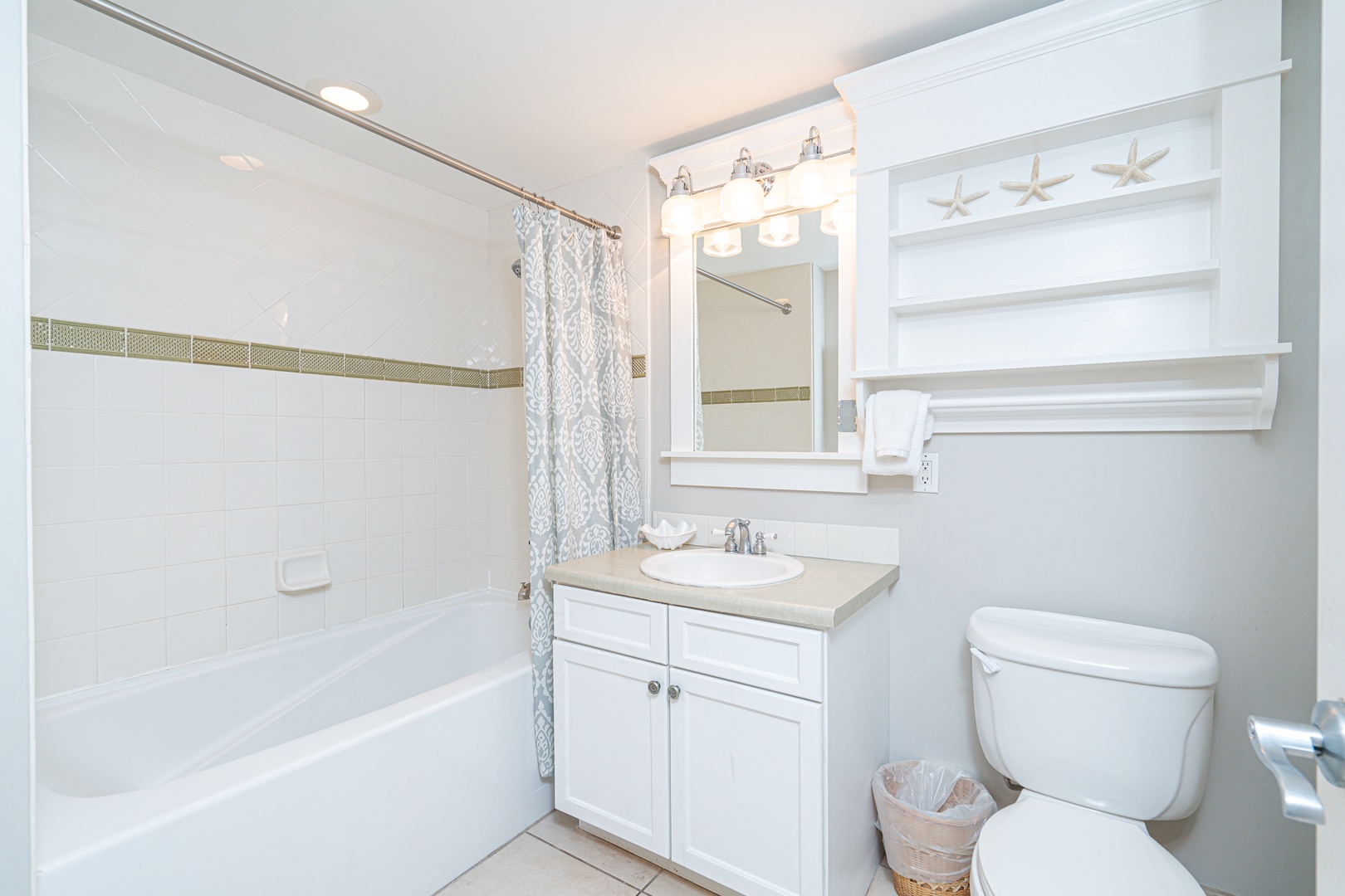A single vanity & shower/tub combo await in the tranquil full bath