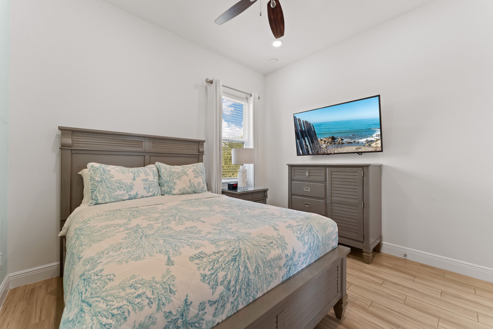 The final bedroom retreat showcases a plush queen bed & smart TV