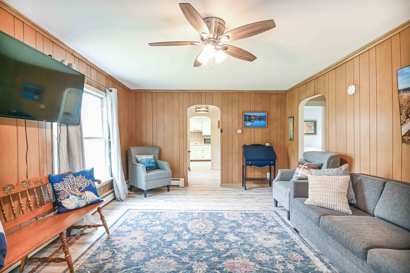 Living room with Smart TV and full size sofa sleeper