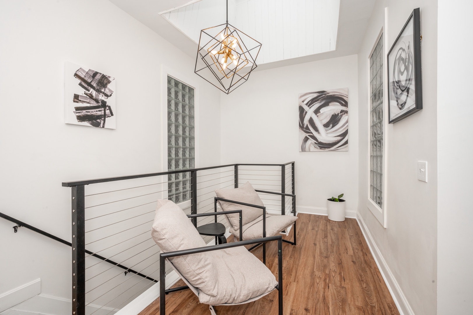 Enjoy the soaring ceilings & wide skylight in the building stairwell