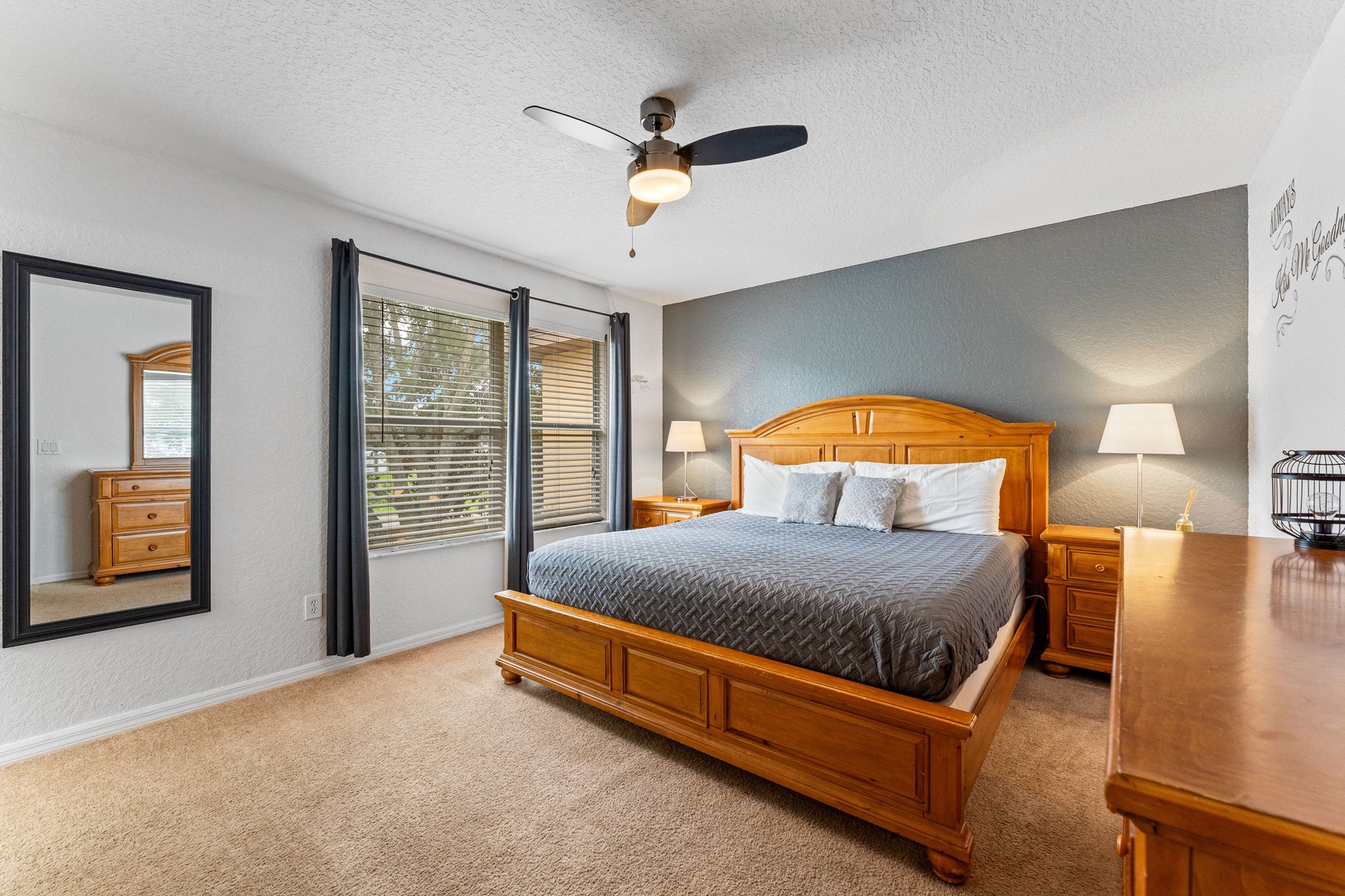 Bedroom 2 with king bed, TV, and ensuite