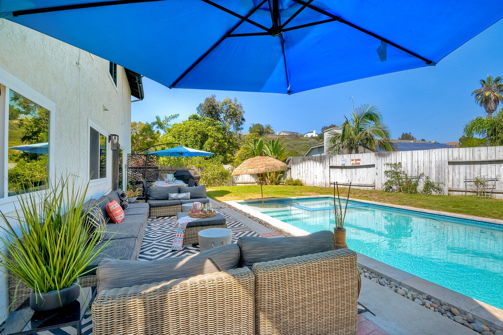 Backyard with ample seating and private pool