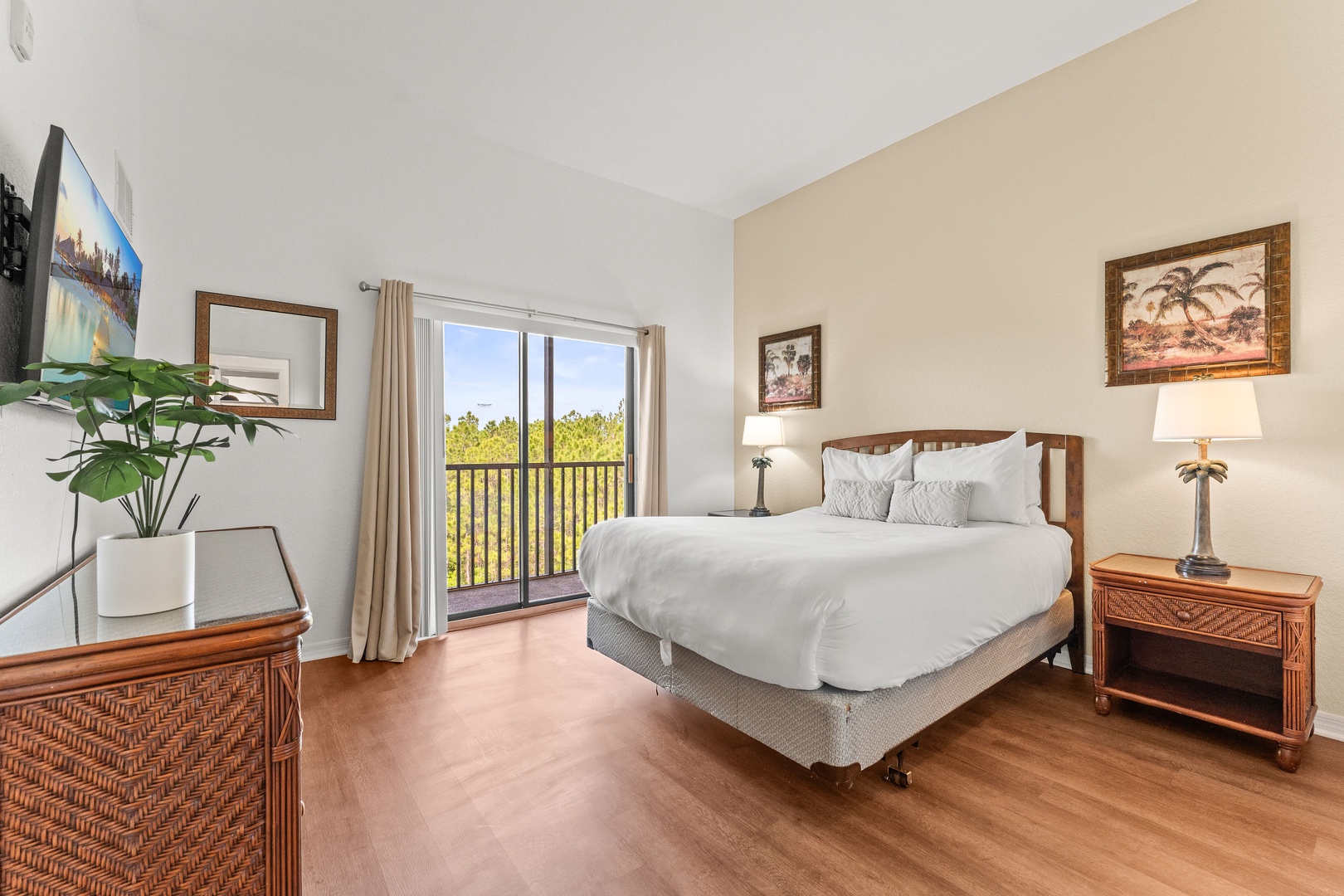 Bedroom 2 with queen bed, balcony, Smart TV, and ensuite