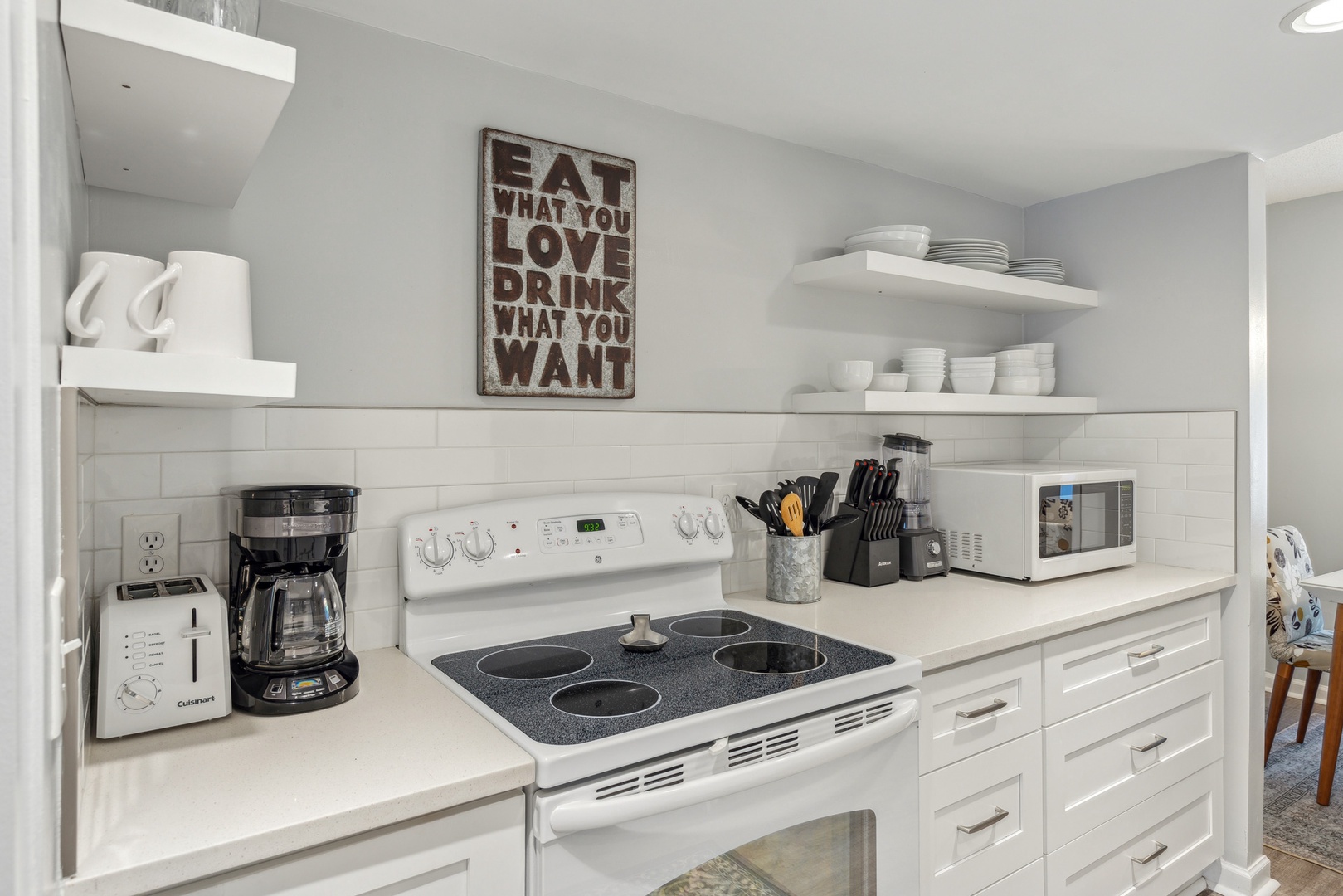 This open, modern kitchen has ample space & all the comforts of home