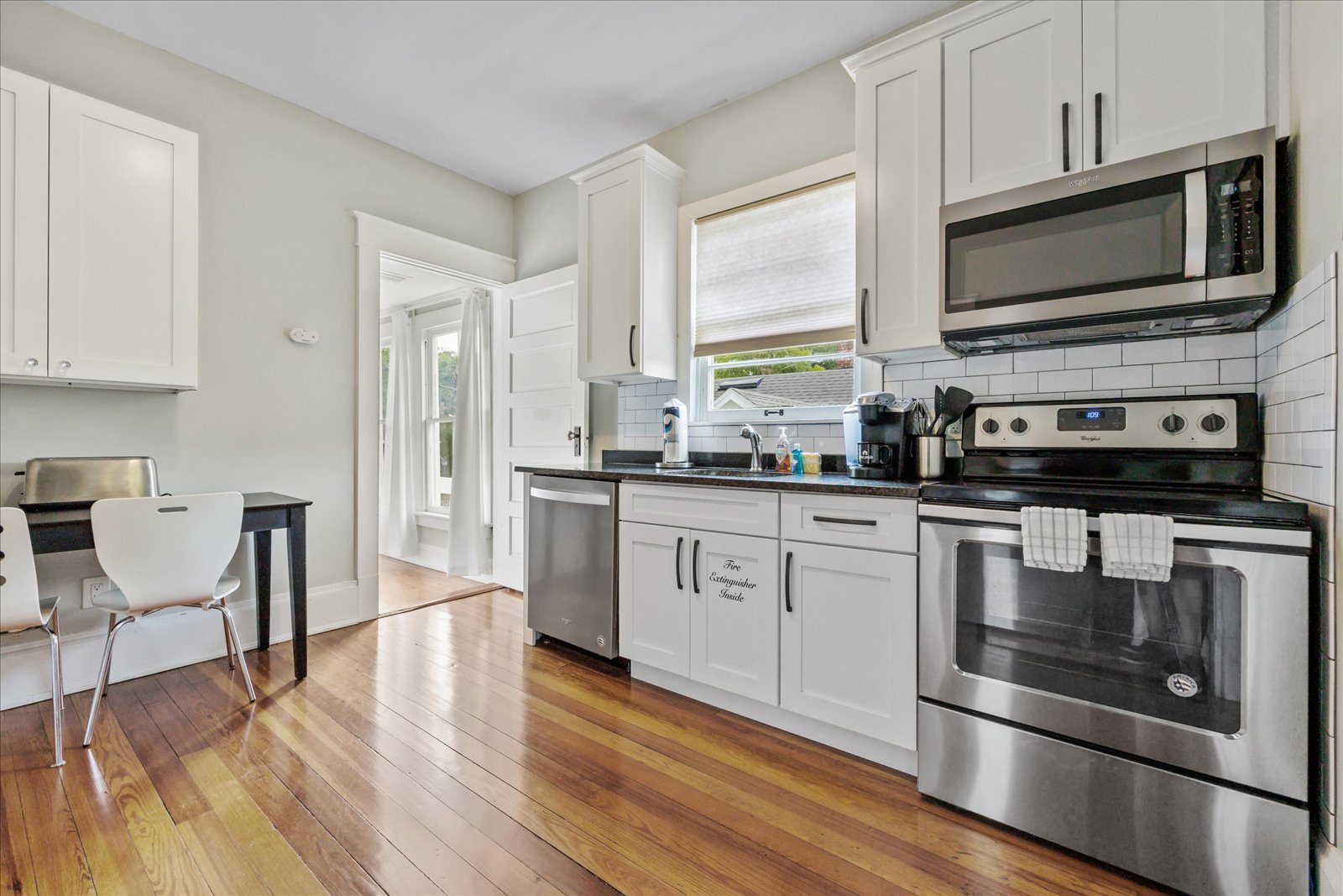 The sunny, eat-in kitchen offers wonderful amenities & ample space