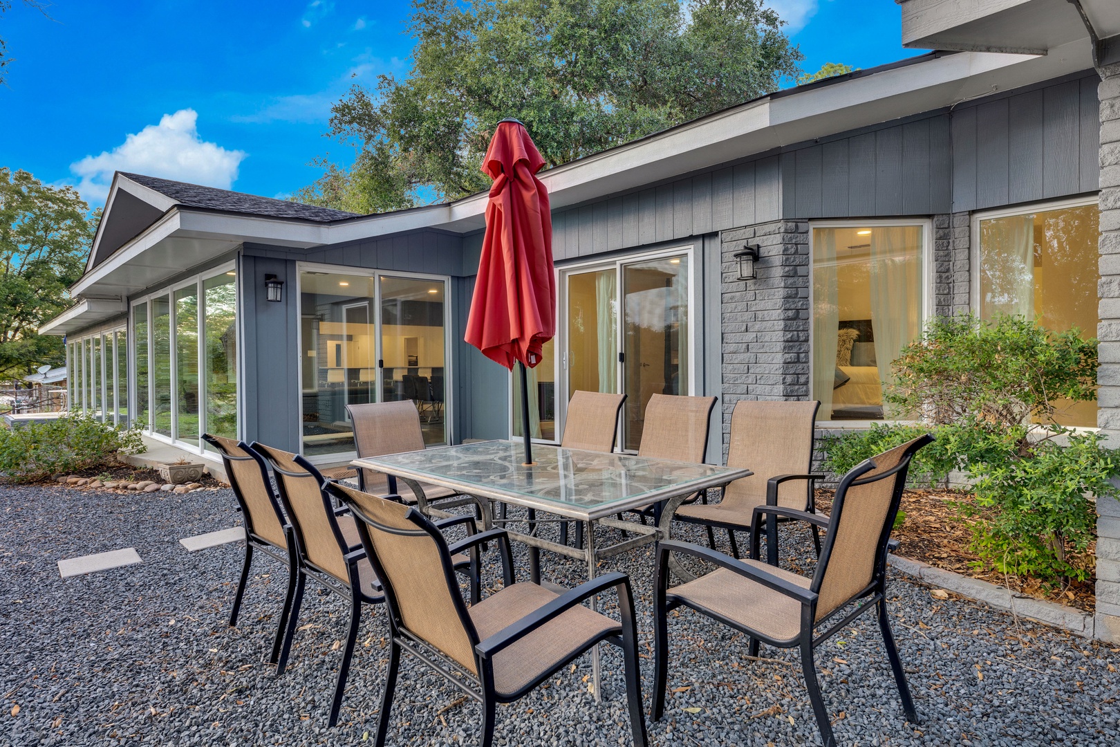 Backyard patio table with charcoal and gas grill