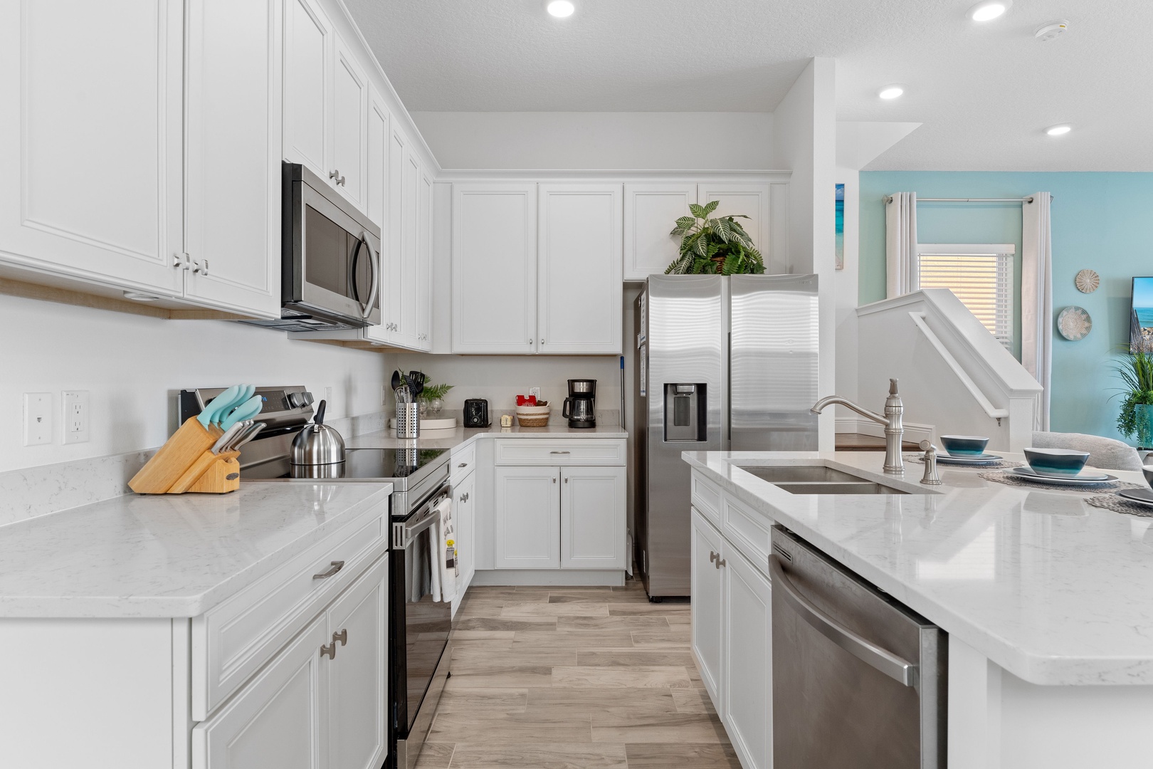 The open, airy kitchen offers ample space & all the comforts of home