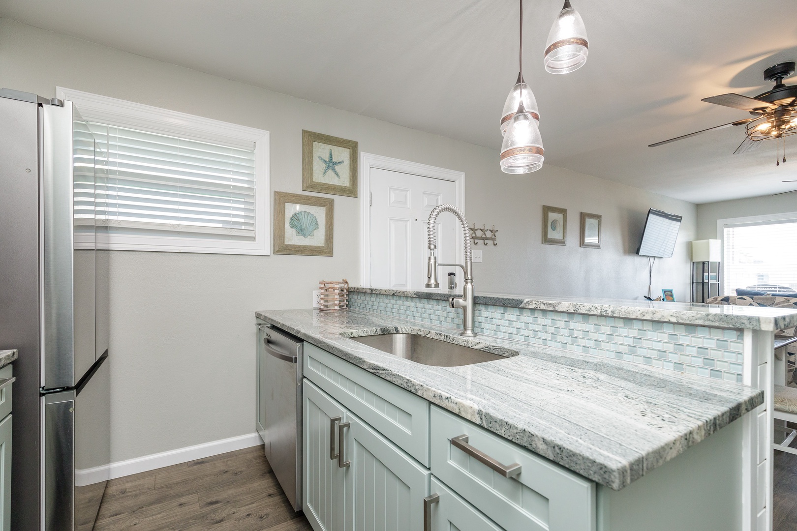 The updated, beachy kitchen offers ample space & all the comforts of home