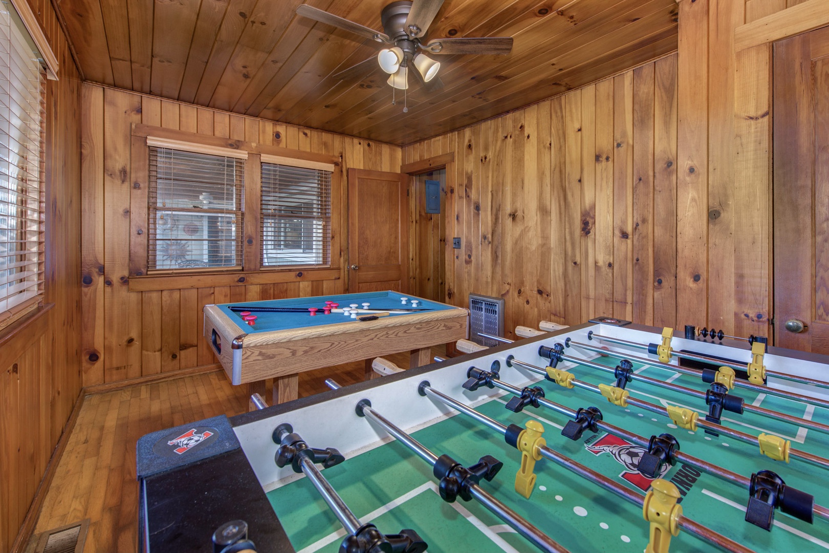 Fun for all in the game room with foosball table, and bumper pool